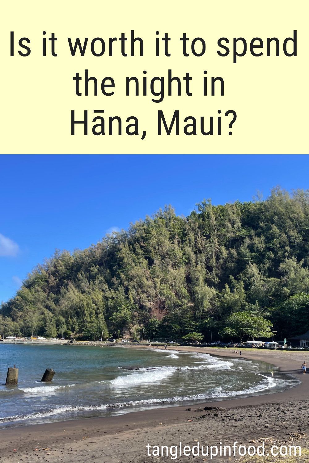 Photo of a sandy beach and text reading "Is it worth it to spend the night in Hana, Maui?"