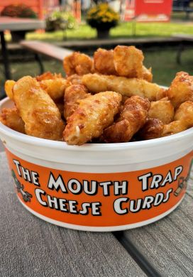 Plastic bucket filled with deep fried cheese curds