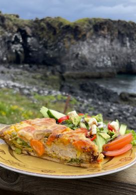 Chicken quiche with sea cliffs in the background