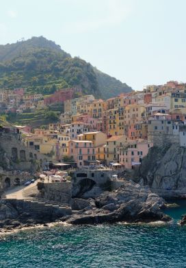 Seaside town of colorful buildings built into a cliff