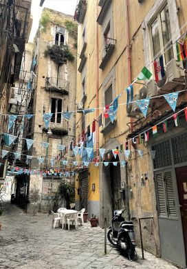 Narrow alley with streamers overhead