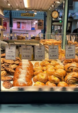 Bakery stall with case filled with savory and sweet pastries