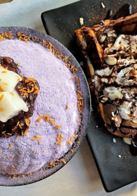 Bowl filled with shave ice covered in lavendar taro powder and a plate with a piece of toast drizzled with chocolate