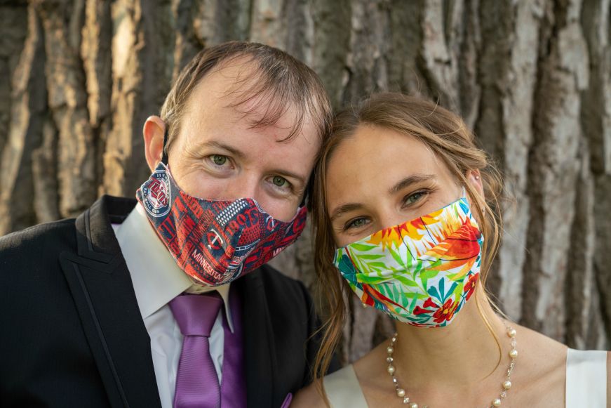 Stacy and Mike in wedding attire and face masks Stacy and Mike in wedding attire and face masks