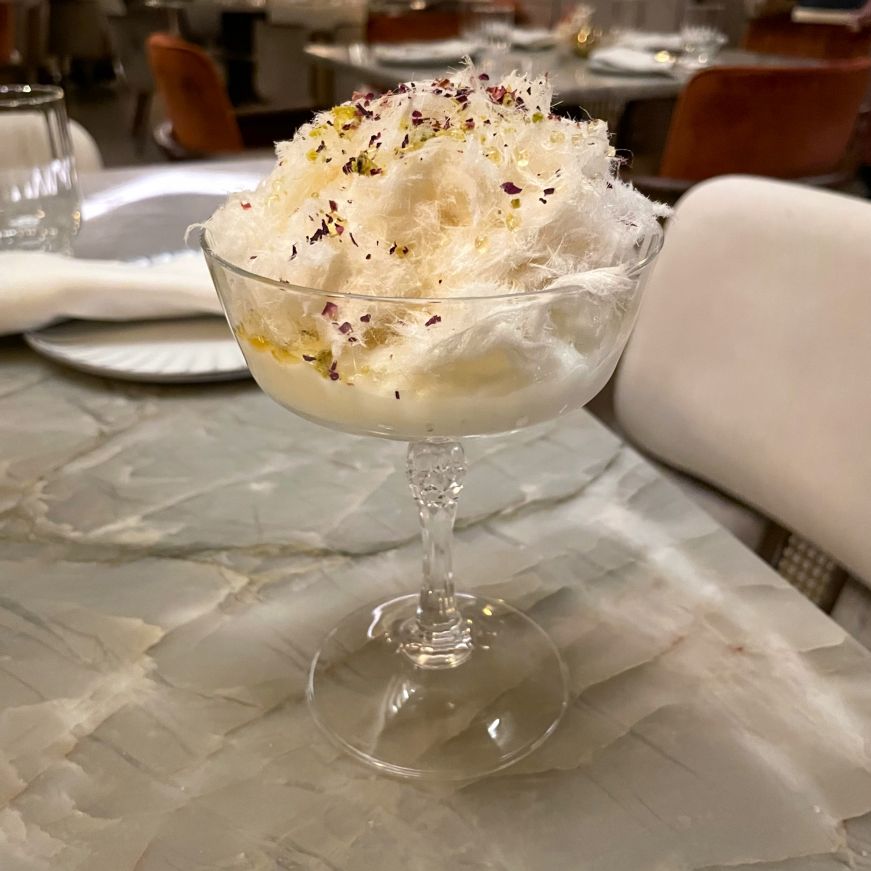 Stemmed dessert cup filled with white whisps of cotton candy