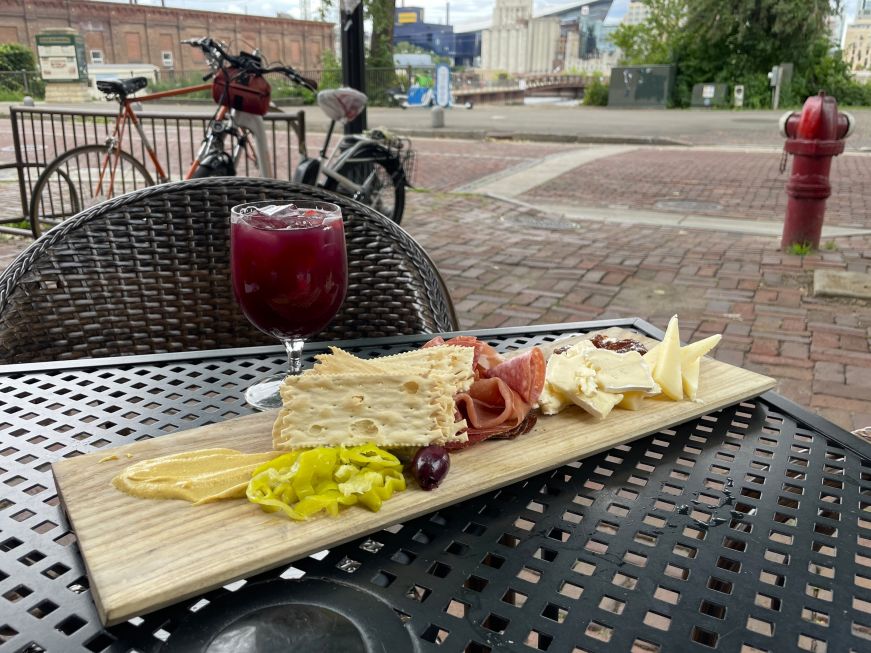 Charcuterie board and sangria on an outdoor table