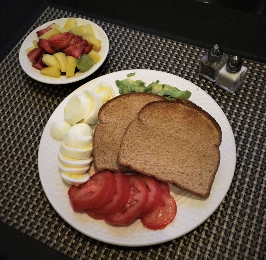 Plate of avocado toast with side of fruit, Chateau Avalon, Kansas City, Kansas