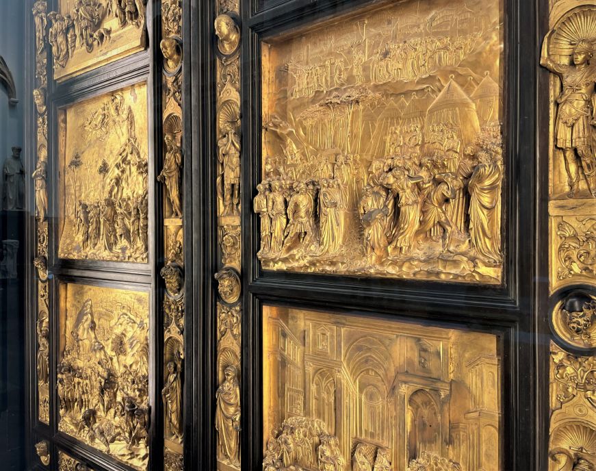 Original baptistery doors in the Santa Maria del Fiore museum Ornate sculpted bronze doors