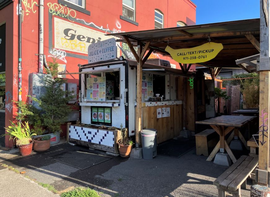 Food trailer with an adjacent covered seating area