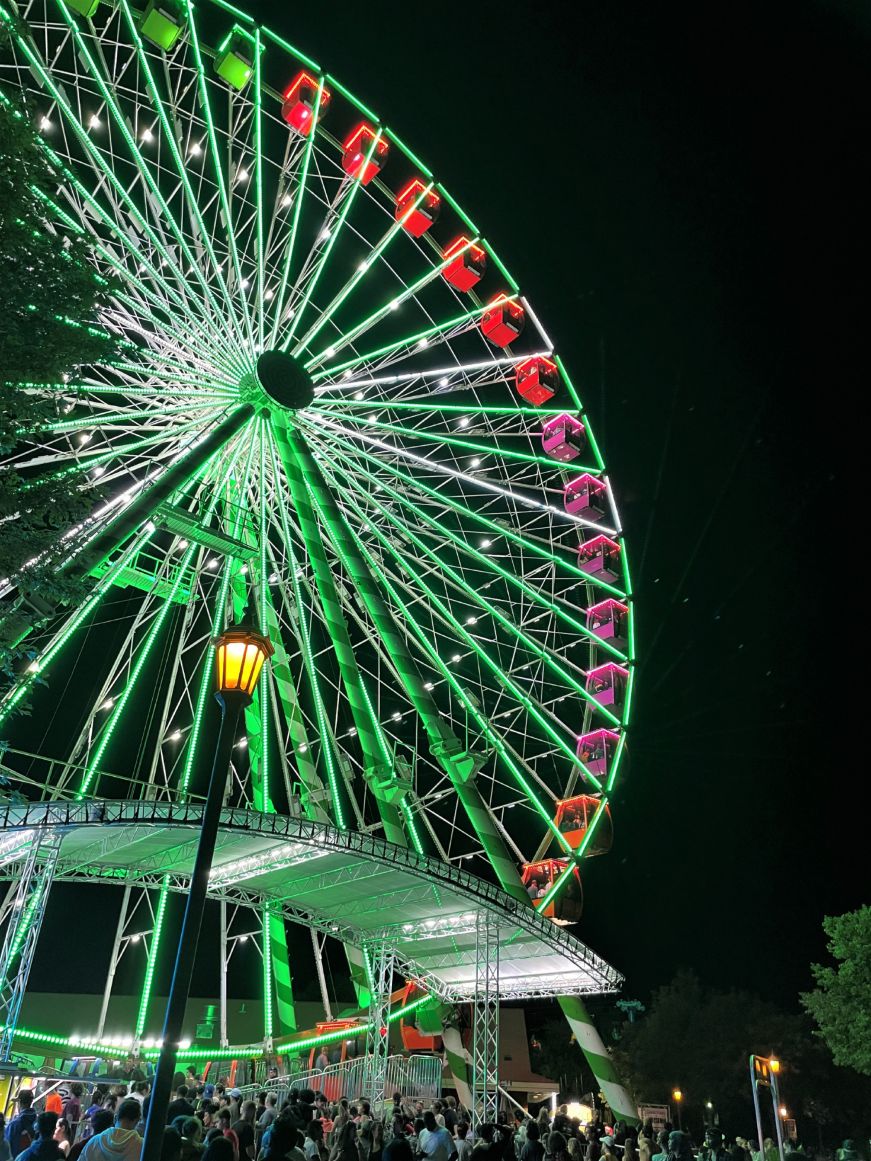 Illuminated Ferris wheel at night