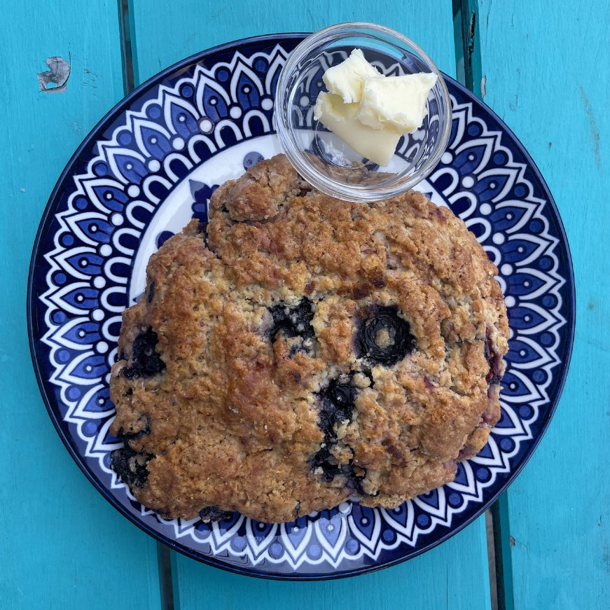 Large blueberry scone on a plate 