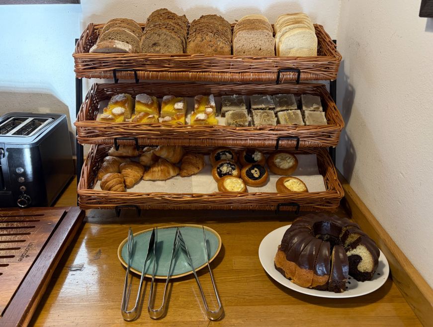 Basket of breads and pastries at a buffet