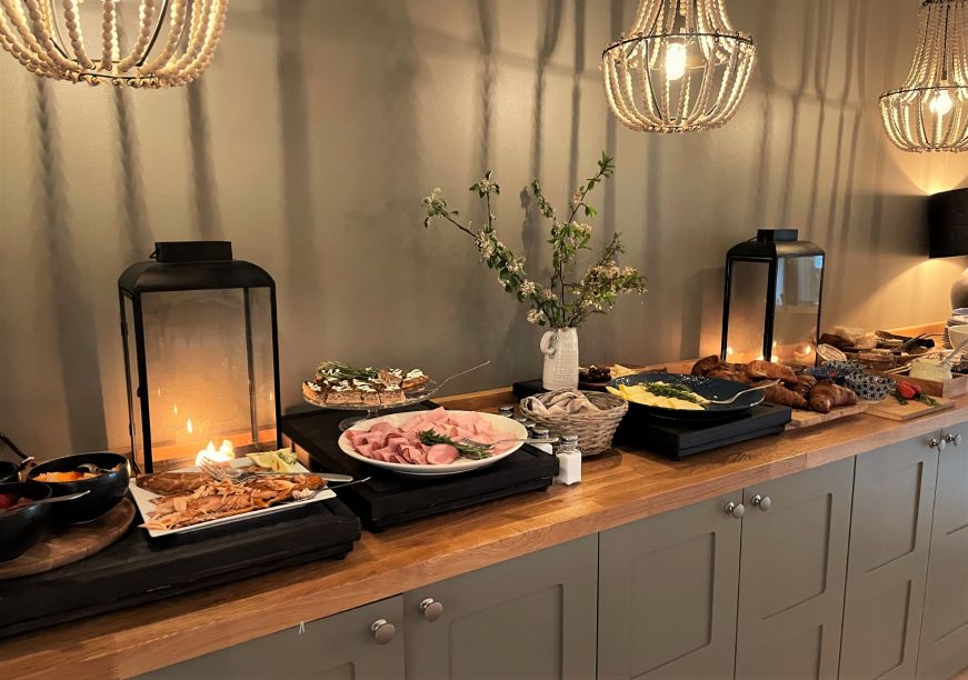 Breakfast buffet, Lillan Hotel Breakfast buffet with croissants, smoked salmon, cheese, and cold cuts