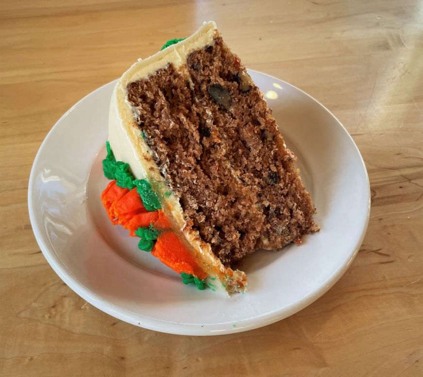 Large slice of carrot cake on a plate