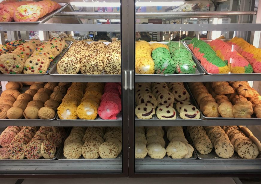 Bakery case with trays of colorful cookies, Bakery Bonito Michoacan, Kansas City, Kansas