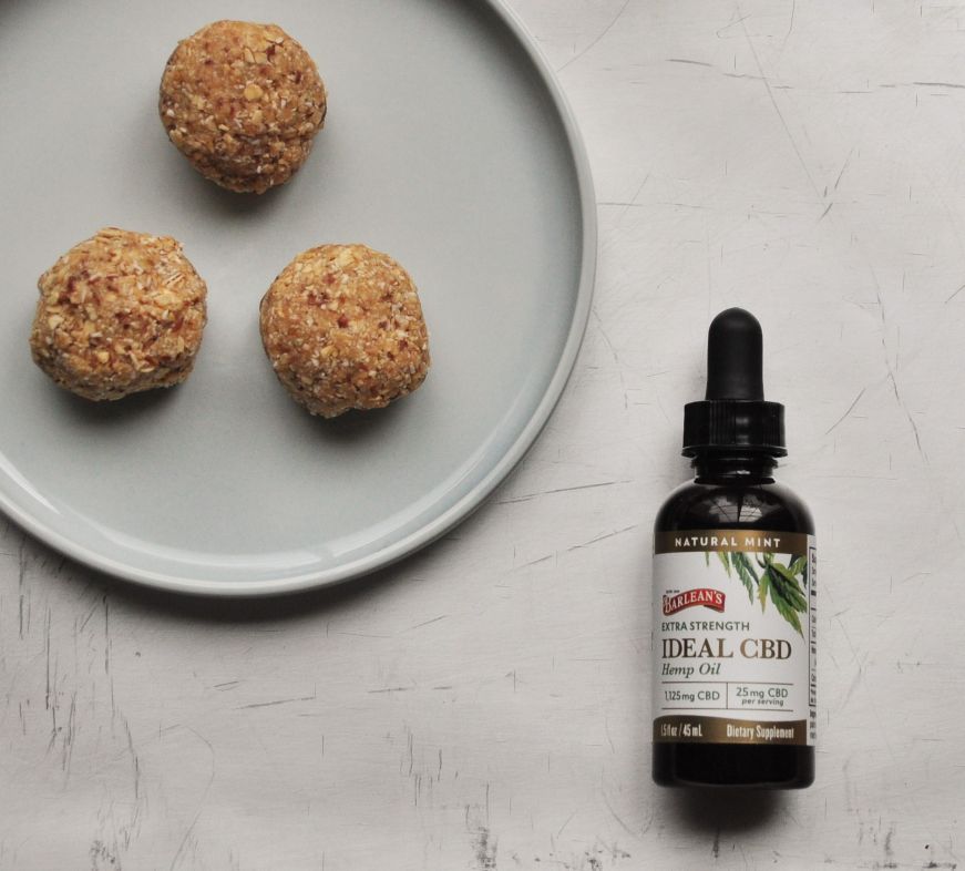 CBD Peanut Butter and Oatmeal Bites on plate with CBD oil