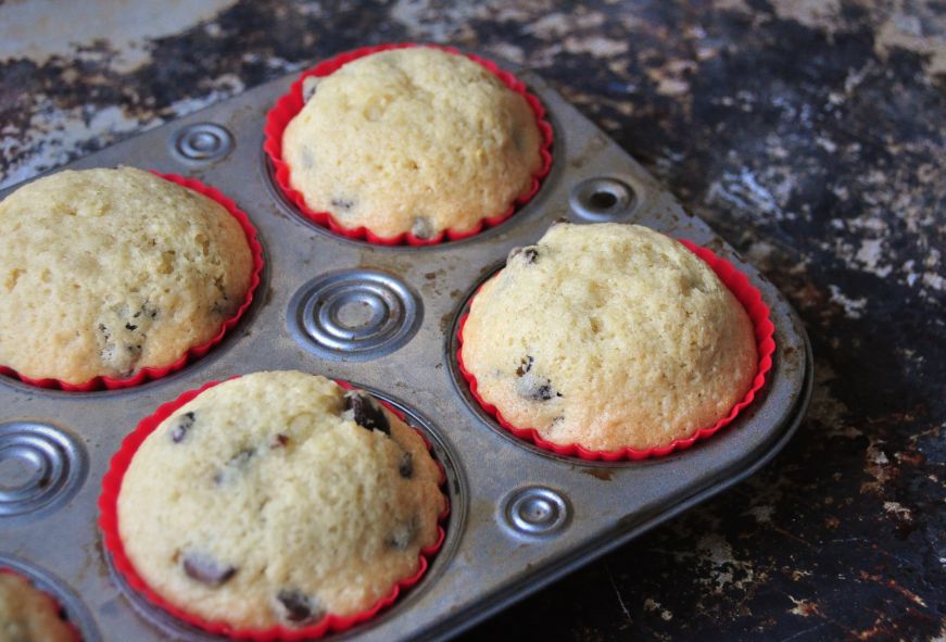 Chocolate chip muffins in a muffin tin