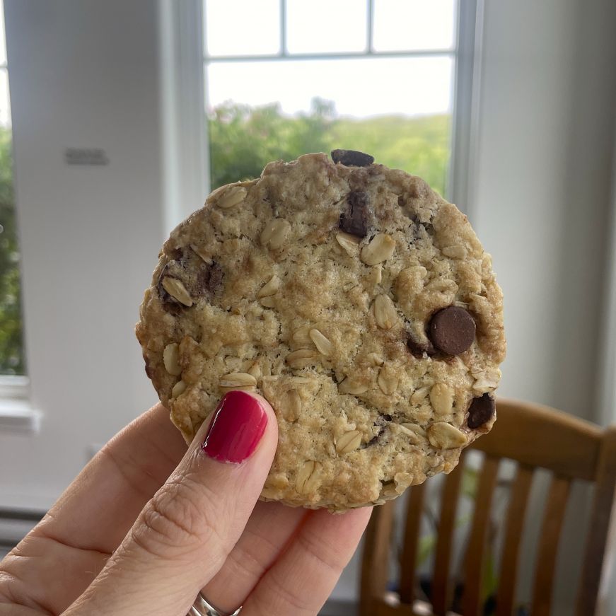 Hand holding a chocolate chip oatcake