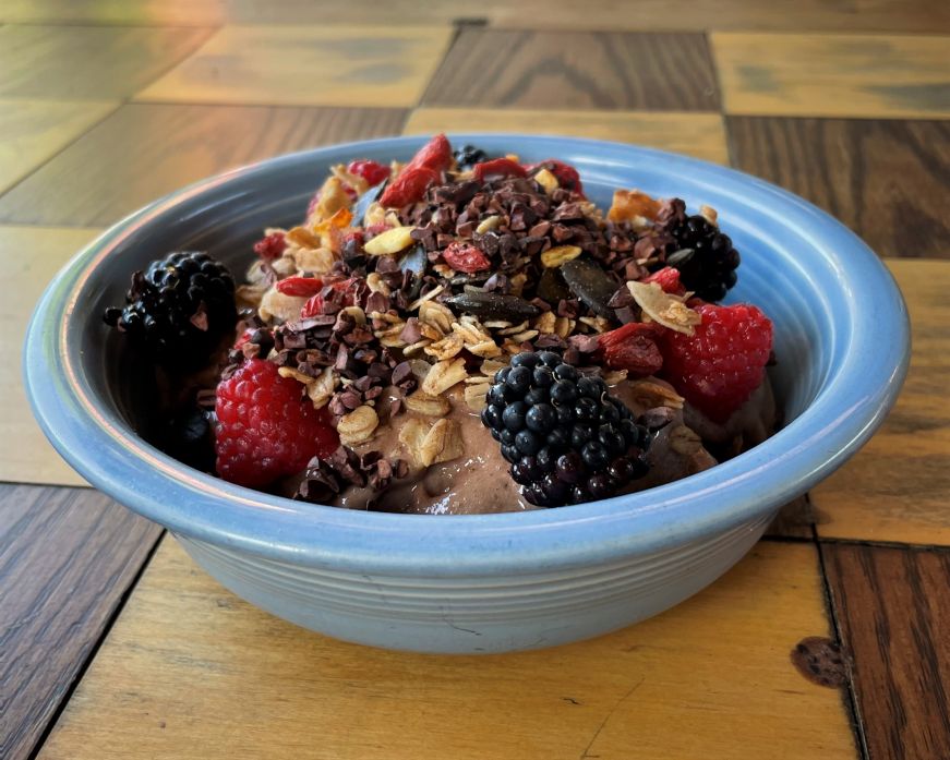 Smoothie bowl topped with berries and granola