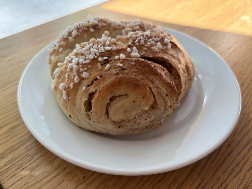Cinnamon bun on a white plate