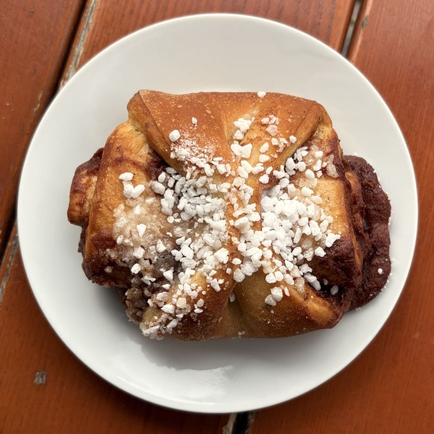 Cinnamon bun topped with pearl sugar