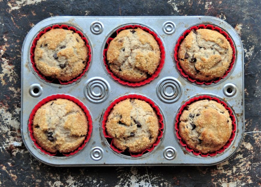 Top down view of Cinnamon Chocolate Chip Muffins in muffin tin