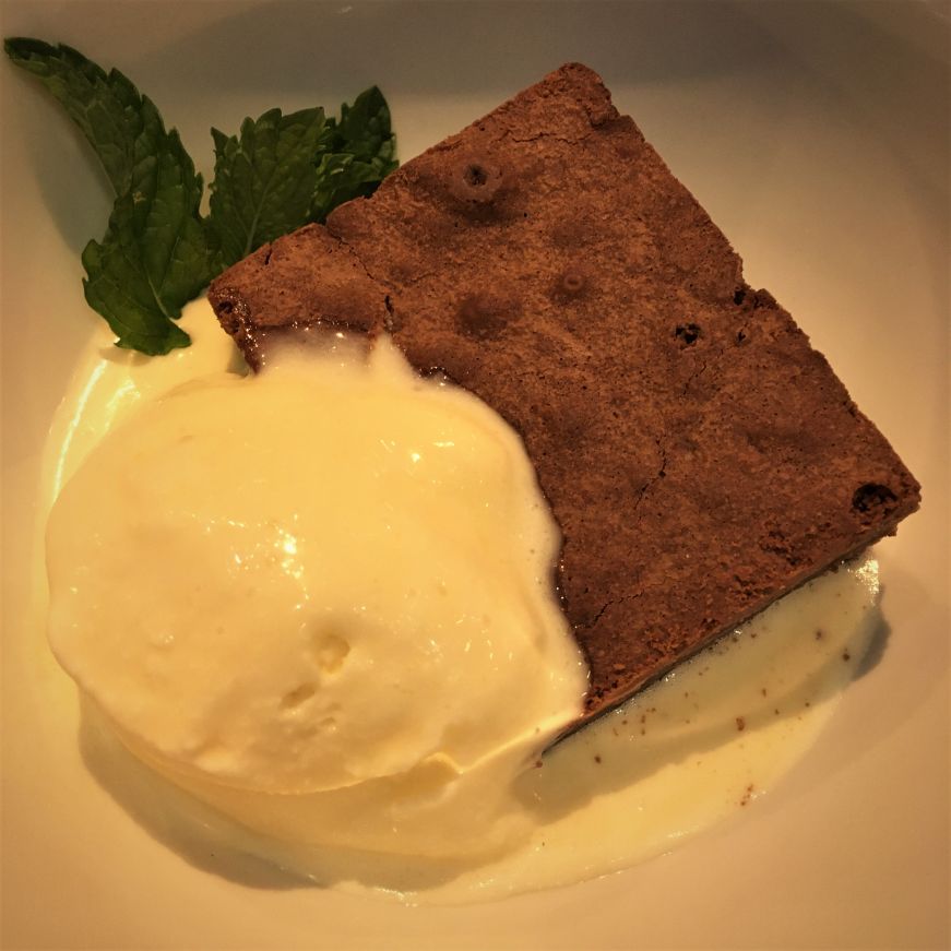Cognac Brownie, Sidebar at Surdyk's Brownie with a scoop of vanilla ice cream