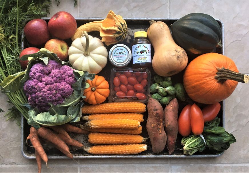 Colorful fall produce arranged on sheet pan