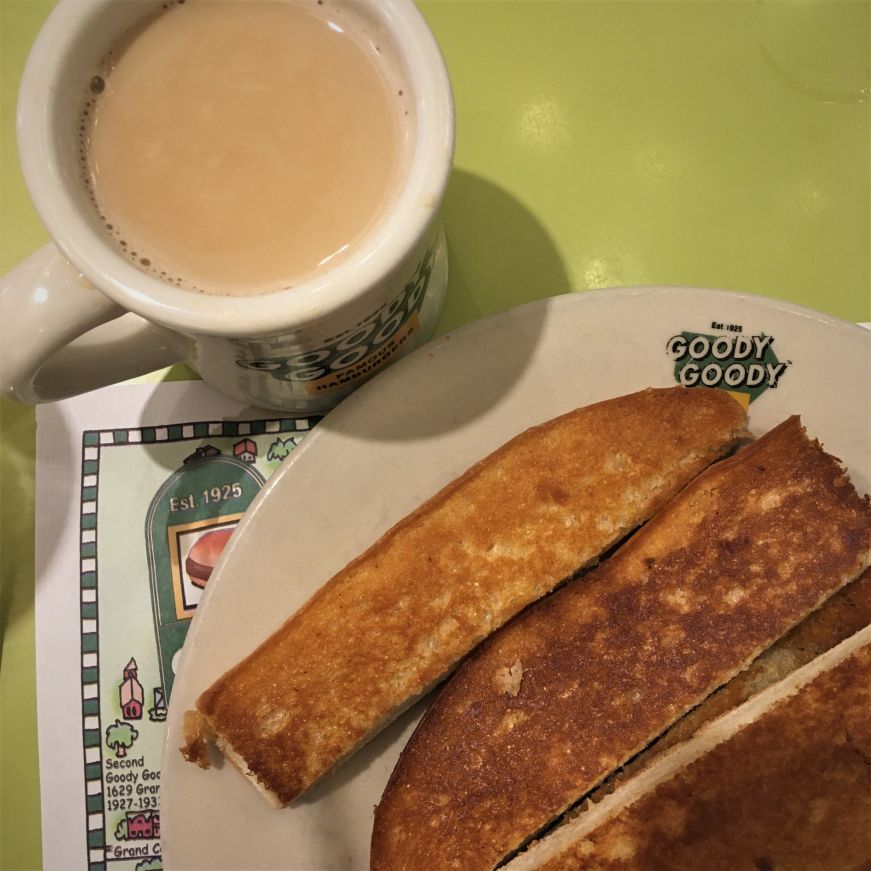 Narrow slices of toast on a plate and cup of coffee with milk, Goody Goody, Tampa