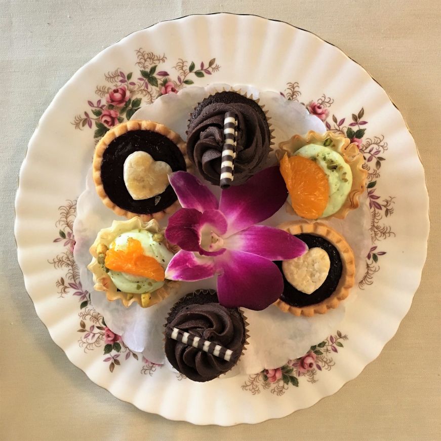 China plate of mini tarts and cupcakes