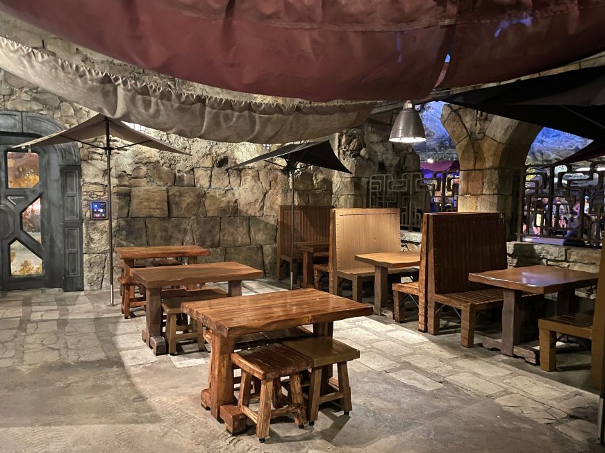 Docking Bay 7 Food and Cargo Seating area with wooden tables