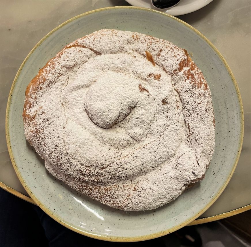 Spiral pastry dusted with powdered sugar