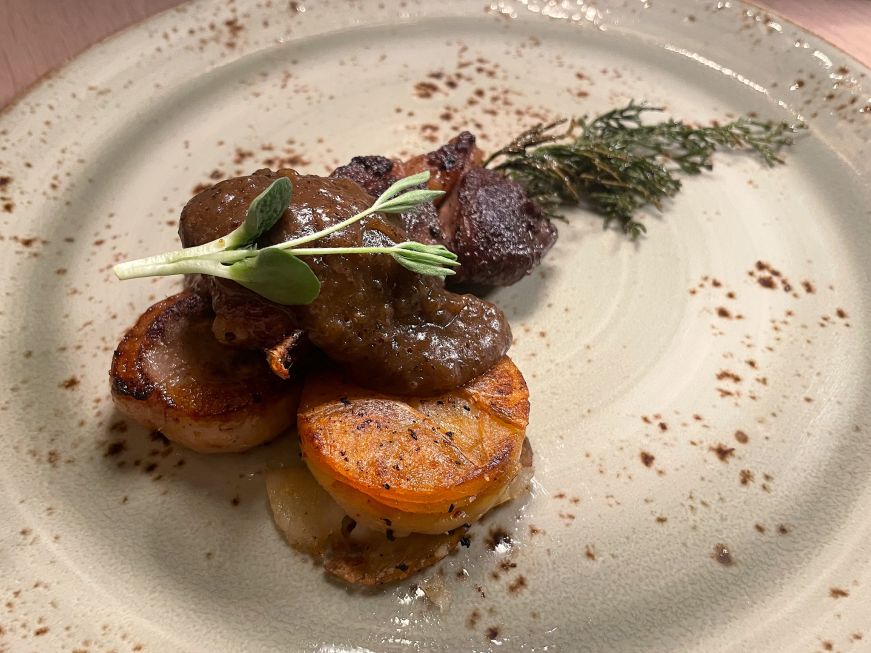 Duck garnished with an evergreen branch