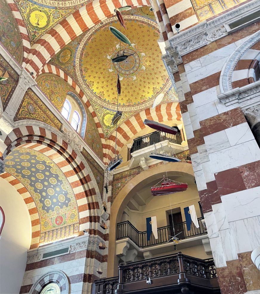 Ship models attached to a church ceiling with string