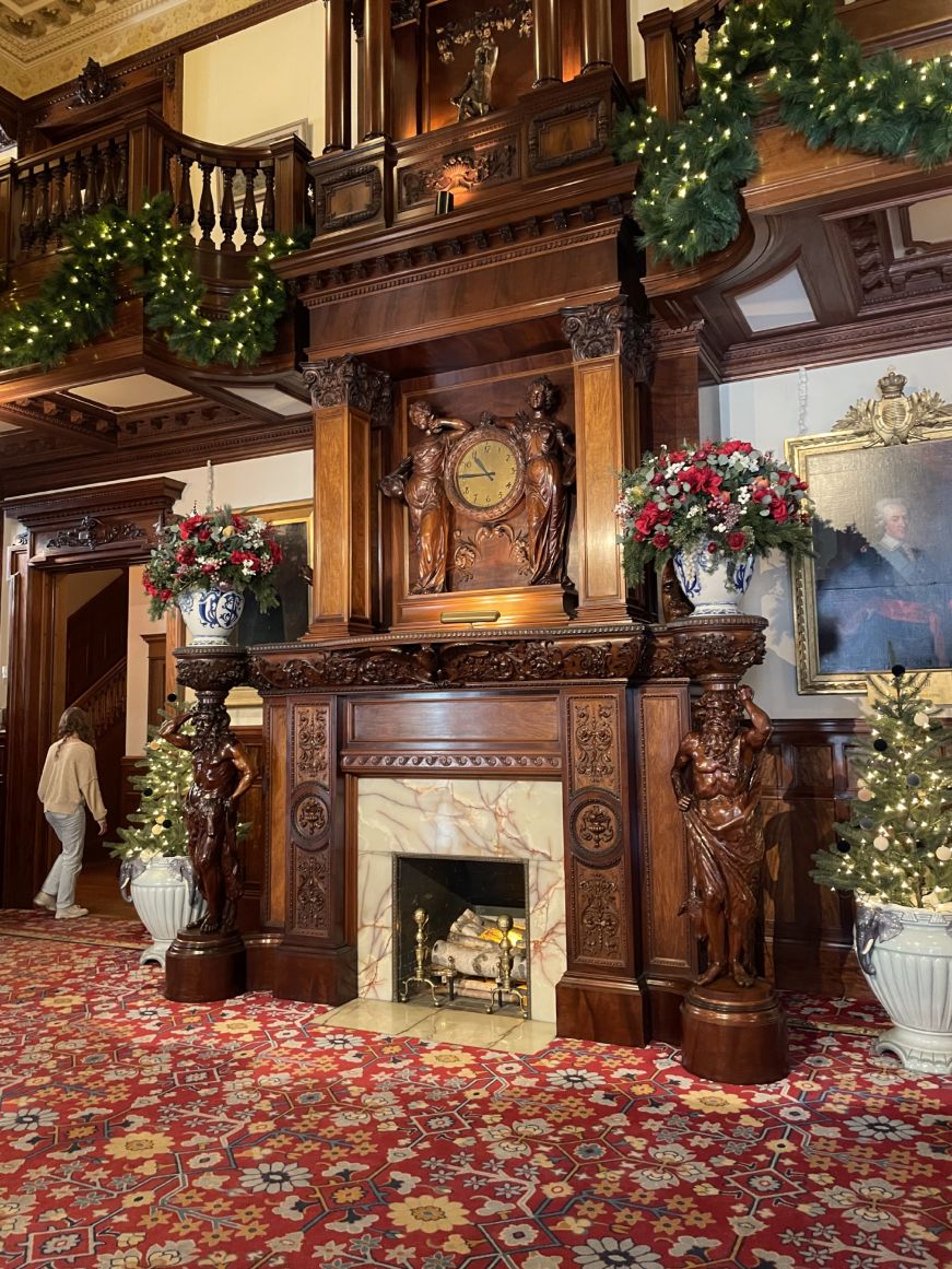 American Swedish Institute Two-story fireplace decorated with elaborate wood carvings