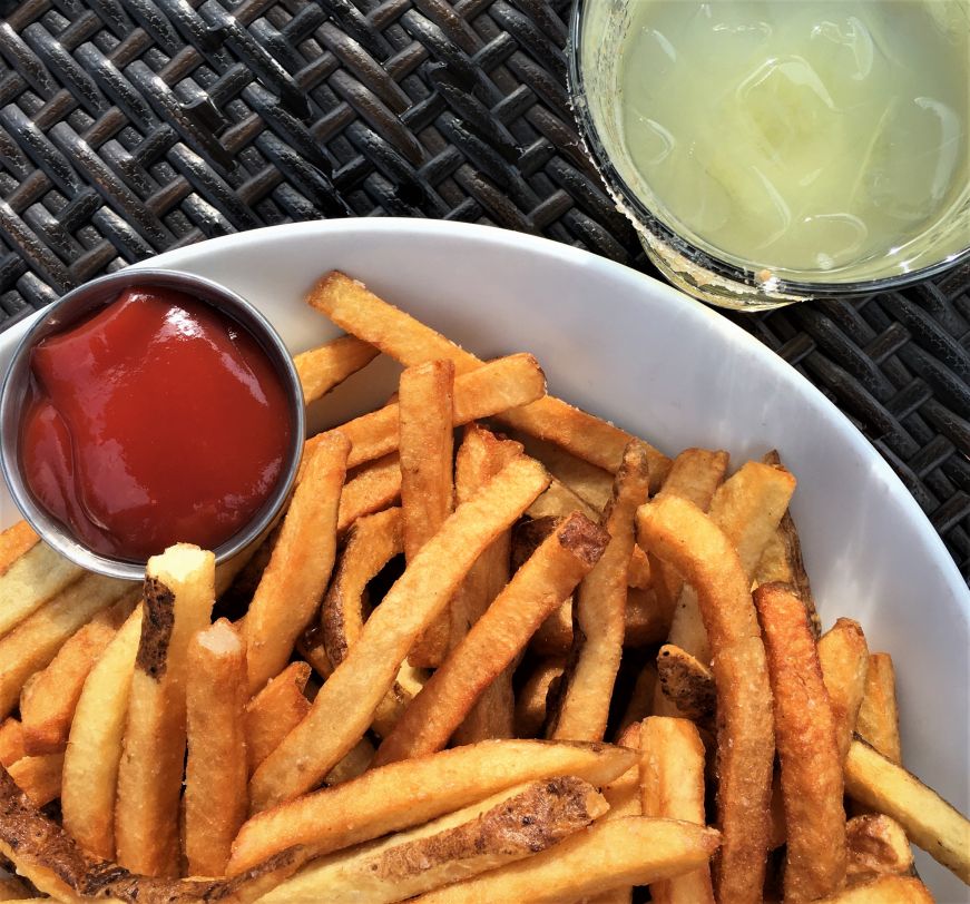 Fries and Mad Monk cocktail, Icehouse French fries with a cup of ketchup and cocktail with a salt rim