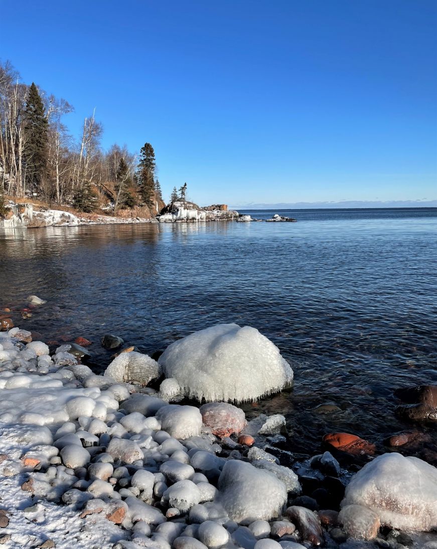 Rocks coated with ice along the shore of Lake Superior