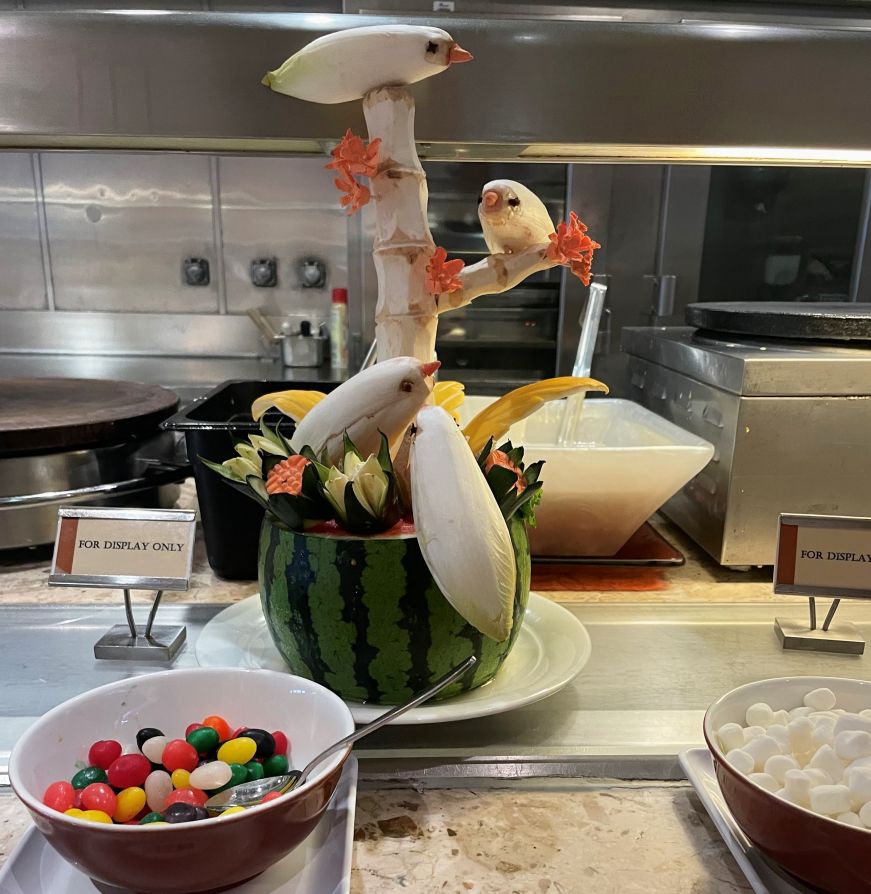 Fruit art at the Garden Cafe, Norwegian Epic Carved fruit art depicting birds sitting on a branch