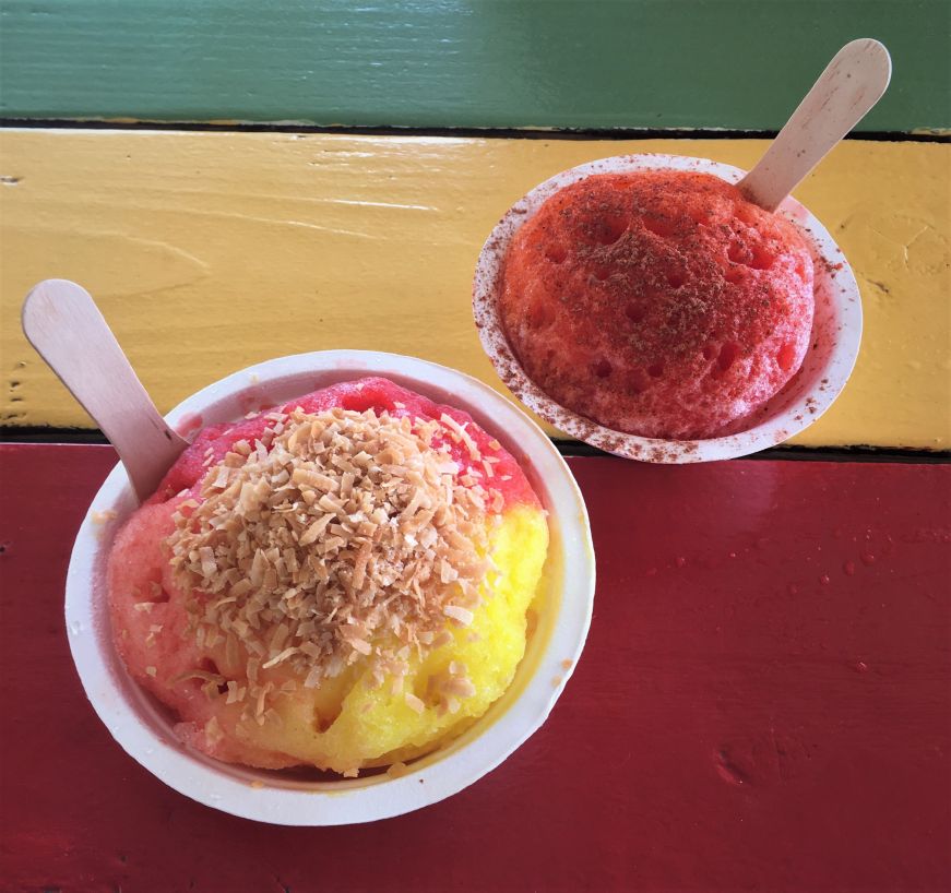 Two cups of shave ice on a red, green, and yellow picnic table, Ululani's Shave Ice, Kihei, Hawaii