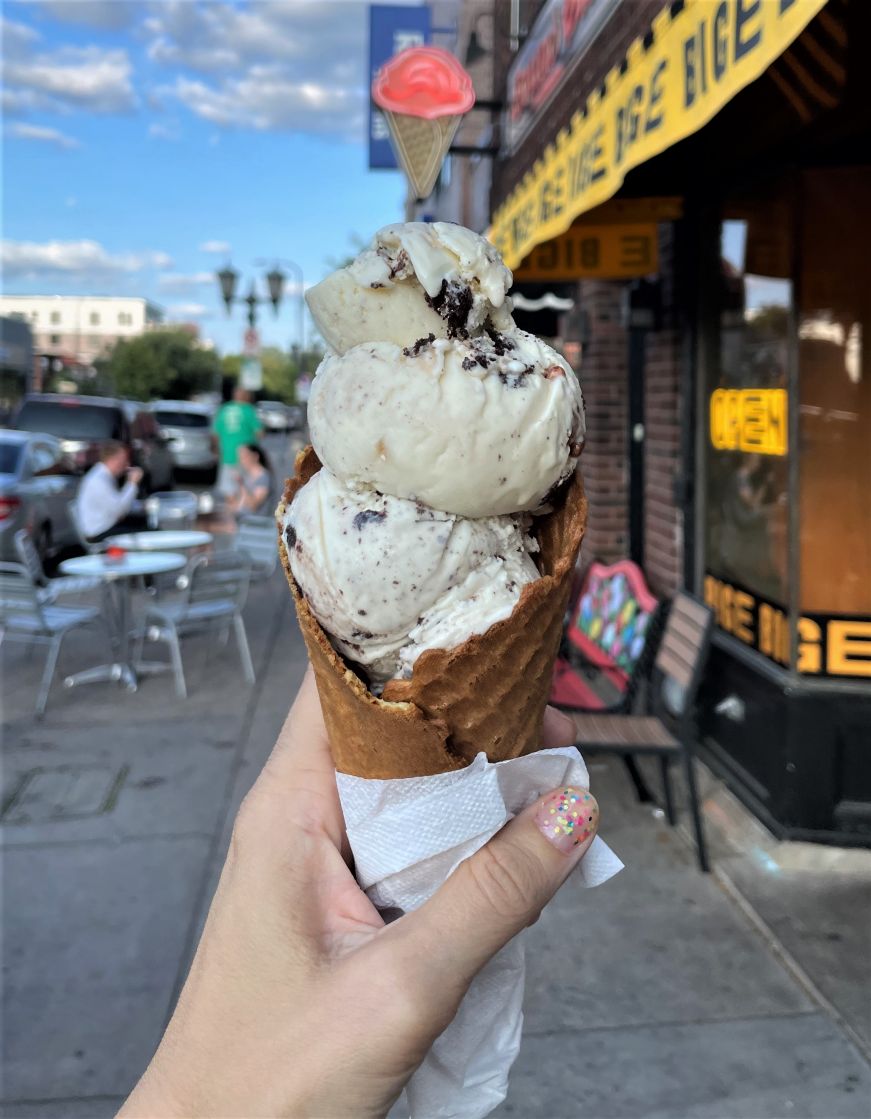 Stacy's hand holding an ice cream cone 