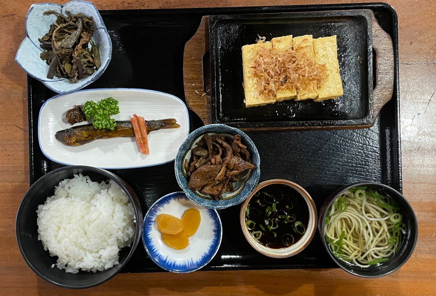 Set meal with grilled tofu, fish, meat, and pickled vegetables