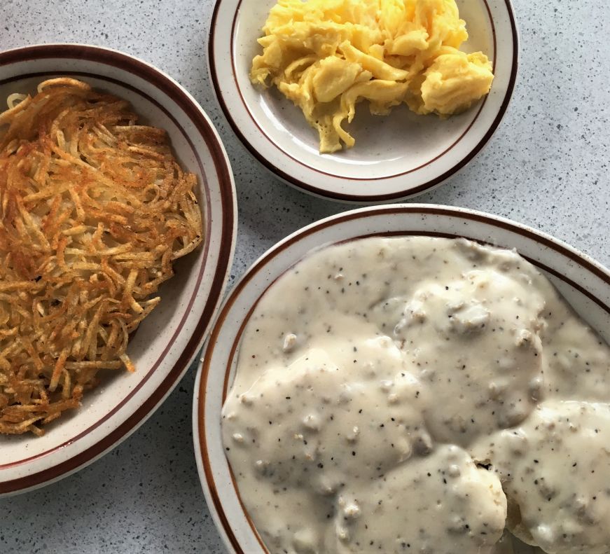 Plates with hashbrowns, scrambled eggs, and biscuits and gravy, Fritz's Railroad Restaurant, Kansas City, Kansas