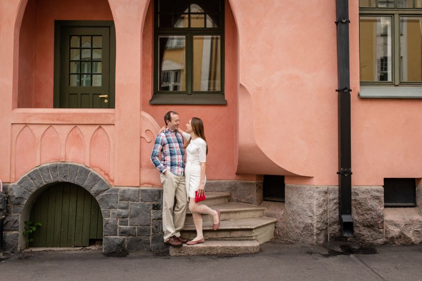 Stacy and Mike in the doorway of a pink home in Huvilakatu, Helsinki