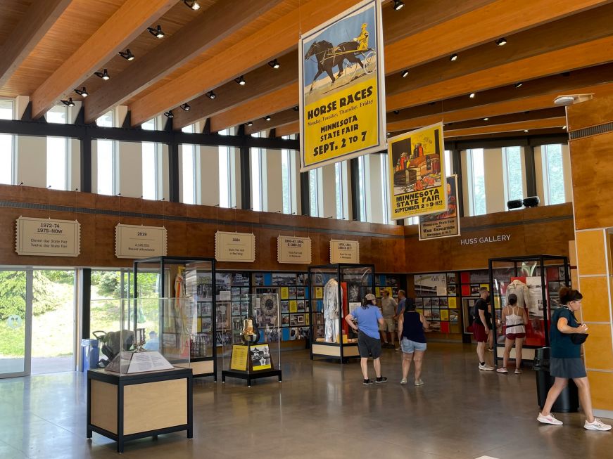 Interior of History & Heritage Center with signs and museum display cases 