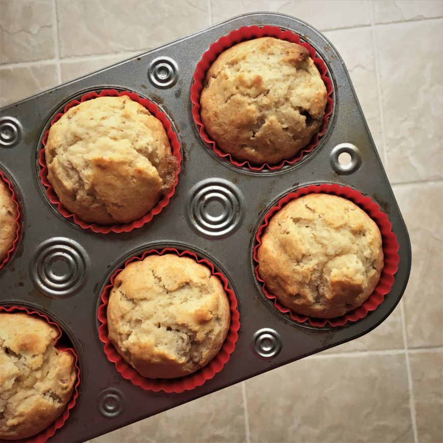 Honey walnut muffins in a muffin tin