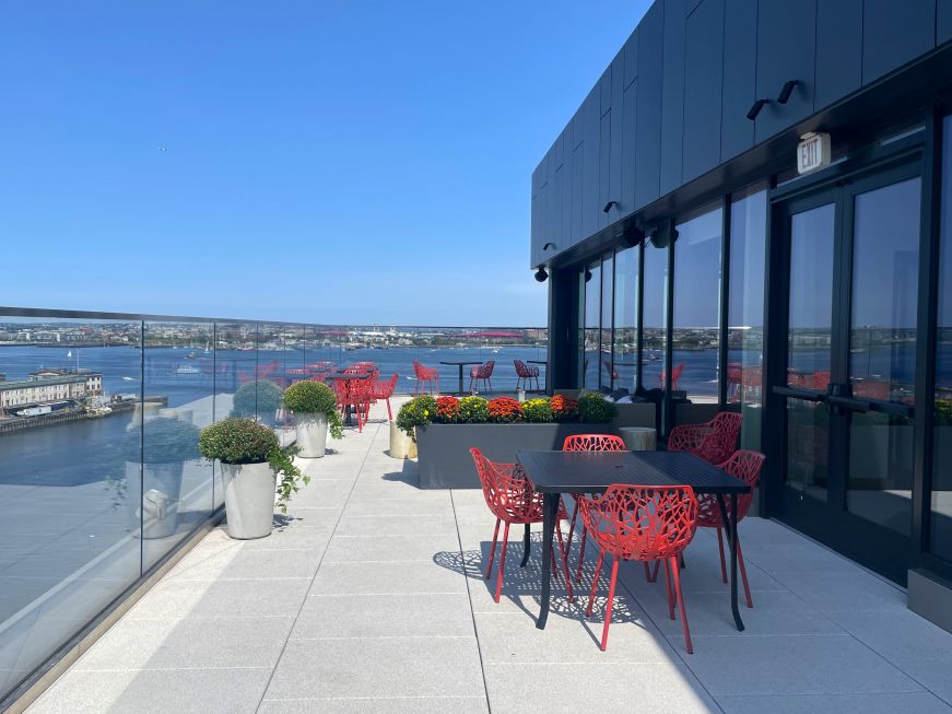 Rooftop at the Hyatt Place Boston Seaport District Rooftop patio with view of harbor