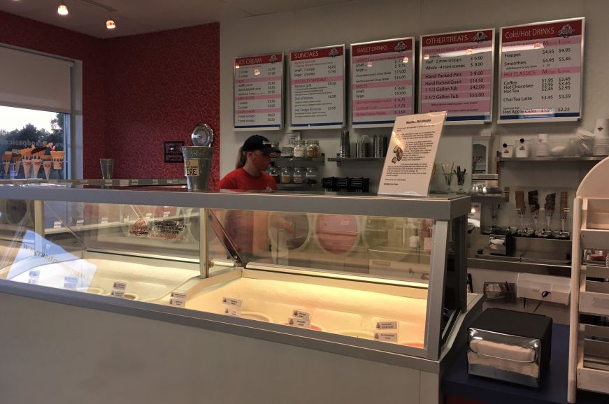 Glass ice cream case and a large menu board