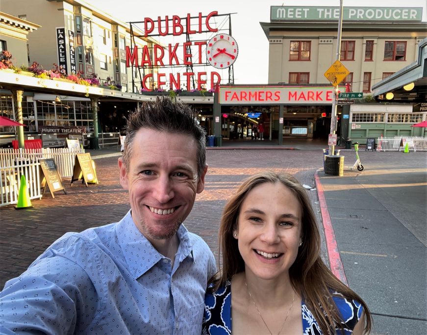 Josh and Stacy in front of the main entrance to Pike Place Market