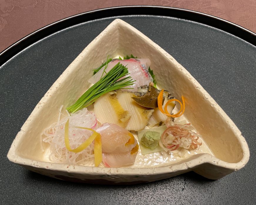 Plate with three small pieces of sashimi