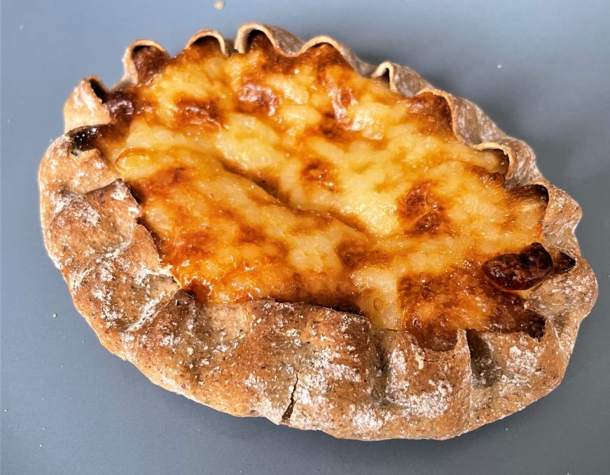 Savory pastry with a thin rye crust and cooked rice filling